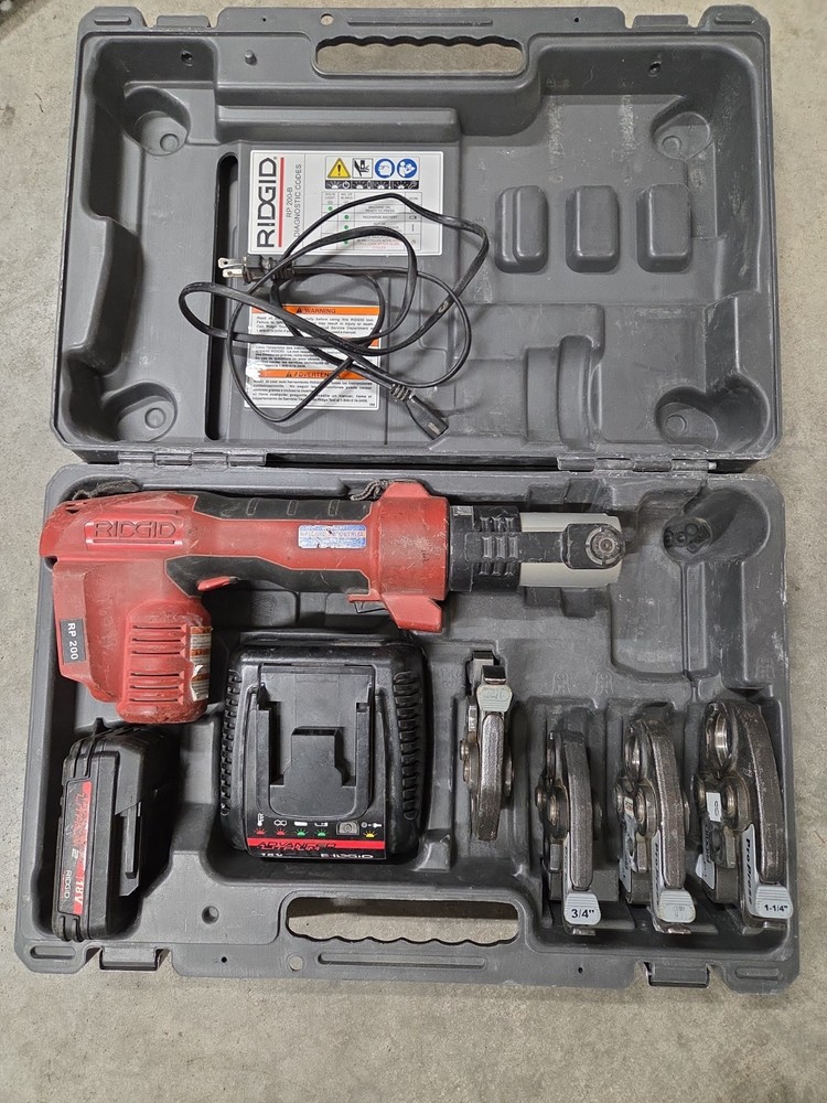 Ridgid RP 200-B Compact Press Tool Kit w/4 Jaws, Battery, And Case Used