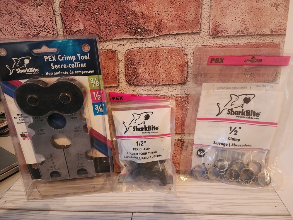 Shark Bite Crimp Tool and 19 bags &ndash; 1/2 Clamps And 26 bags &ndash; 1/2 Pex Clamps.
