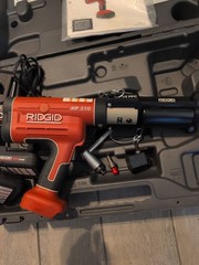 Nice RIDGID RP 210 Press Tool Kit for PEX with 2 Batteries ,Charger, 1/2 Clamps